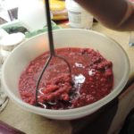 mashing fruit in bowl