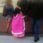 little girl in pink cloak