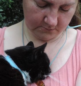 woman holds cat